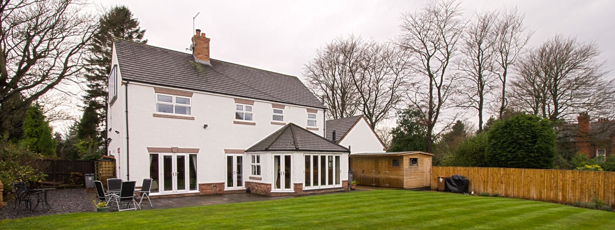 Banner image showing the rear of property with full house installation of Mock Sash UPVC windows.
