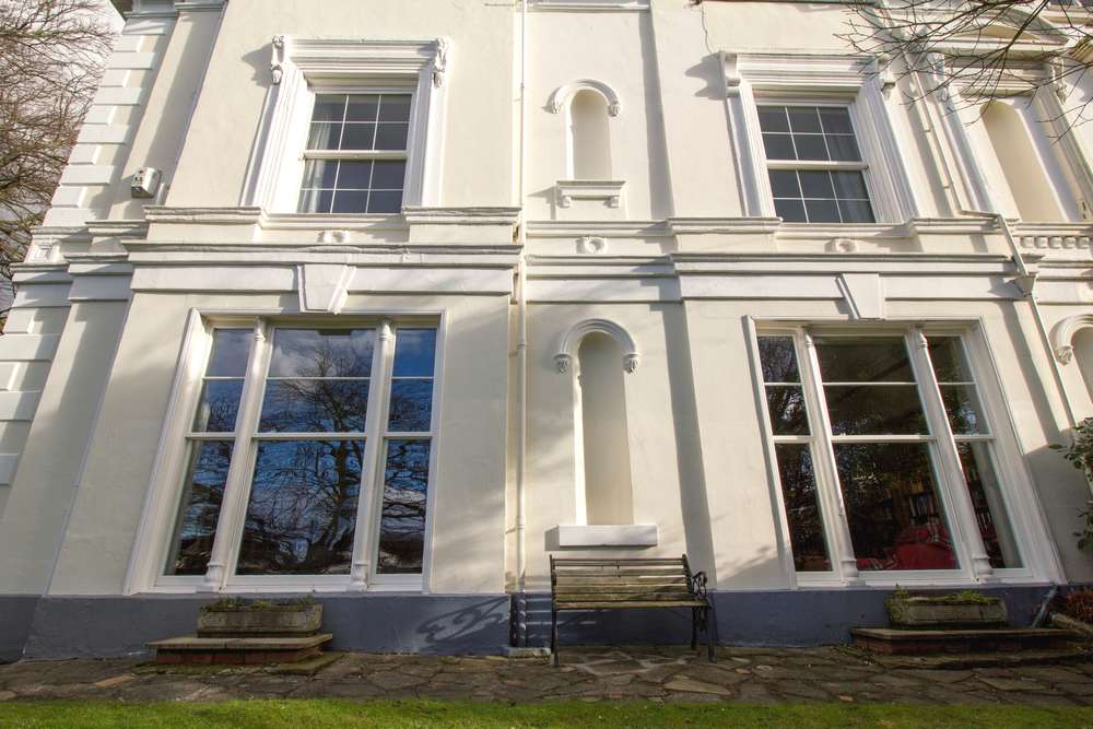 Front of house featuring these stunning triple sliding sash windows with feature decorative columns.
