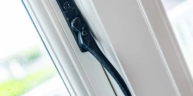 Black window handle close up 