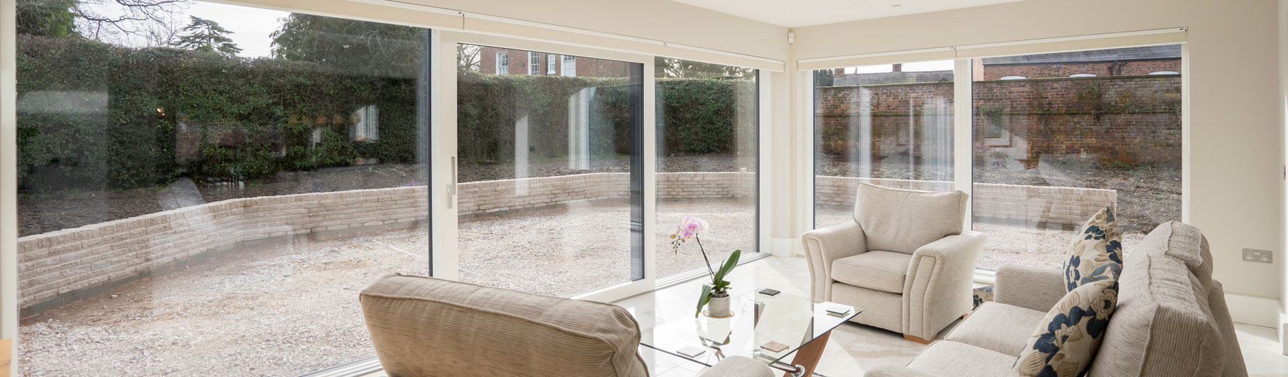 Garden room fitted with dual large alu clad sliding doors.