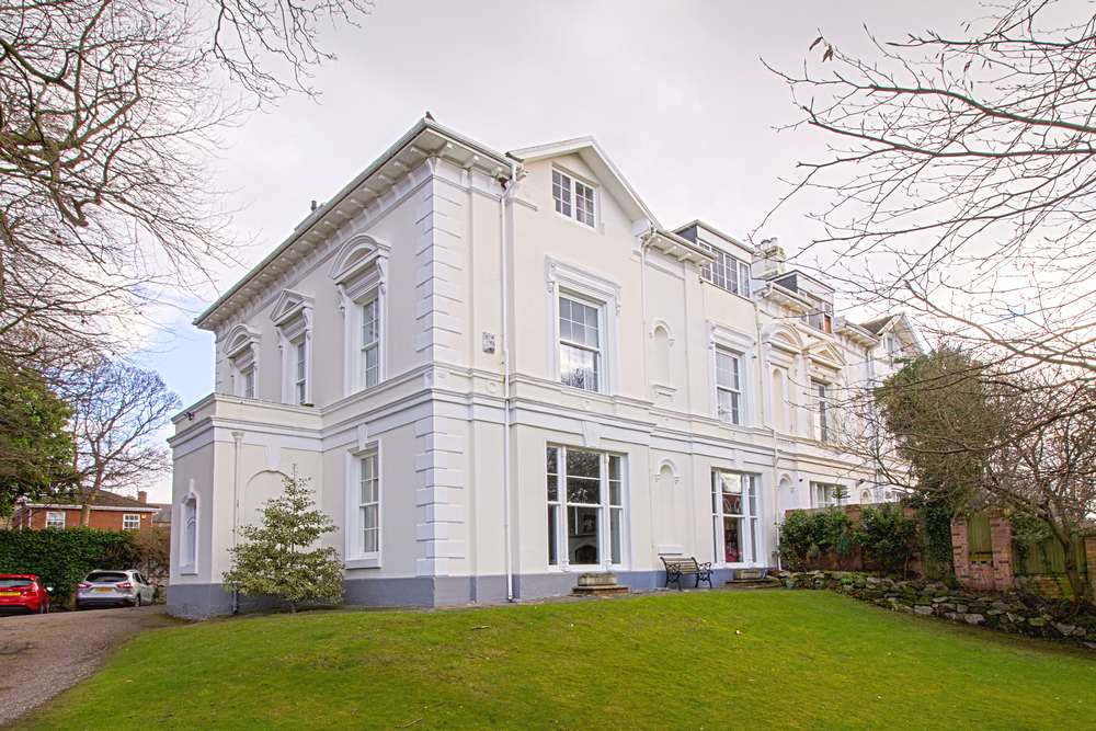 Corner shot of Regency property in Wirral featuring large installation of Roseview sash windows.