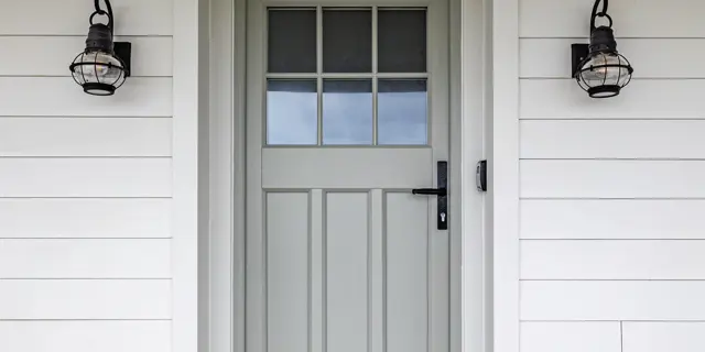 Closed front door with shoe stand outside