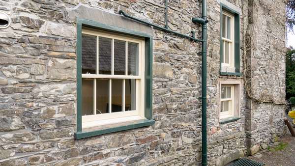 Three alu clad sash windows supplied in a yellow/beige colour to match the exisitng timber windows.