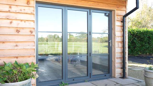 External view of steel alternative aluminium bifolding door installed in Cheshire.