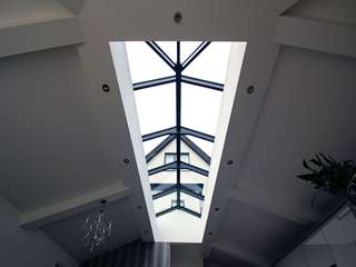 Internal shot of the aluminuium roof lantern looking up at the grey aluminium windows in Cheshire.