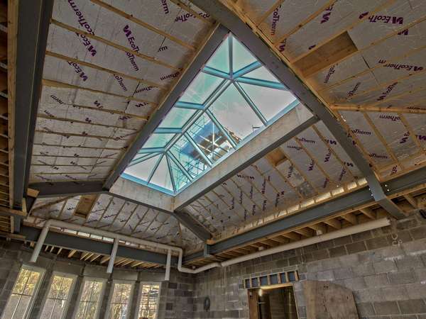 Internal shot of aluminium roof lantern installation showing structual elements of the roof.