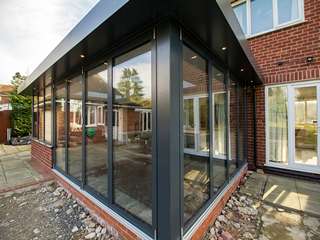 Corner view of dual Centor bifold doors great for opening the internal space to the outside world for summer days and holidays.