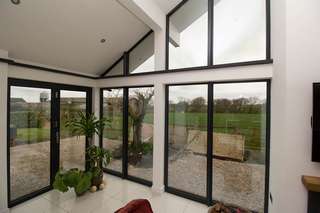 Alternative corner shot showing aluminium windows and Centor bifold doors.