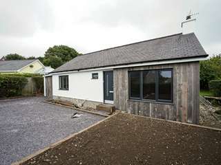 Main shot of detached Bungalow in Criccieth, Wales featuring Rationel Slimline alu-clad windows and doors.