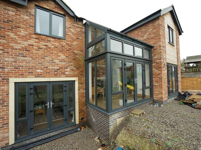 Feature glazed area maximising on light and view of the stunning landscape at the rear of the property.