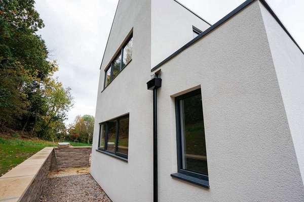 Rear view of the property, 3 larger aluminium windows have been installed here in RAL 7016 grey contrasting perfectly against the cream k-rend.
