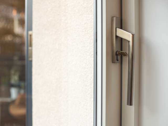 Close up of stainless steel sliding door handle.