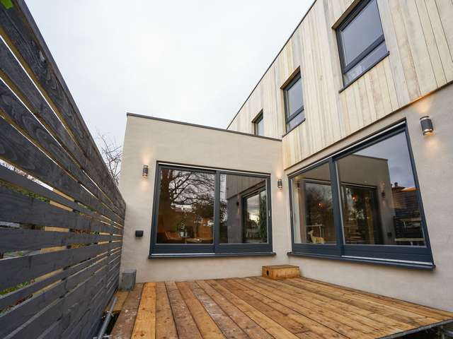Rear entertaining areas with dual Rationel alu-clad timber sliding door supplied and fitted in West Kirby, Wirral.