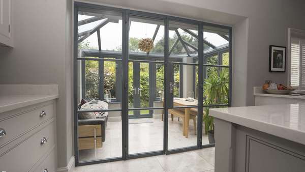 Internal view of the Crittall screen featuring a set of french doors and side lights.