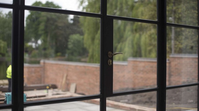 Close up showing the brass look handle on the Crittall screen.
