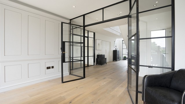 The dark crittall screens contrasting well with the wall panelling.
