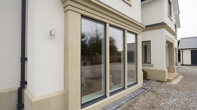 External view of the tripple feature floor to ceiling alu clad windows.