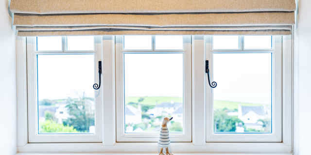 Framed window with duck ornament in the middle 