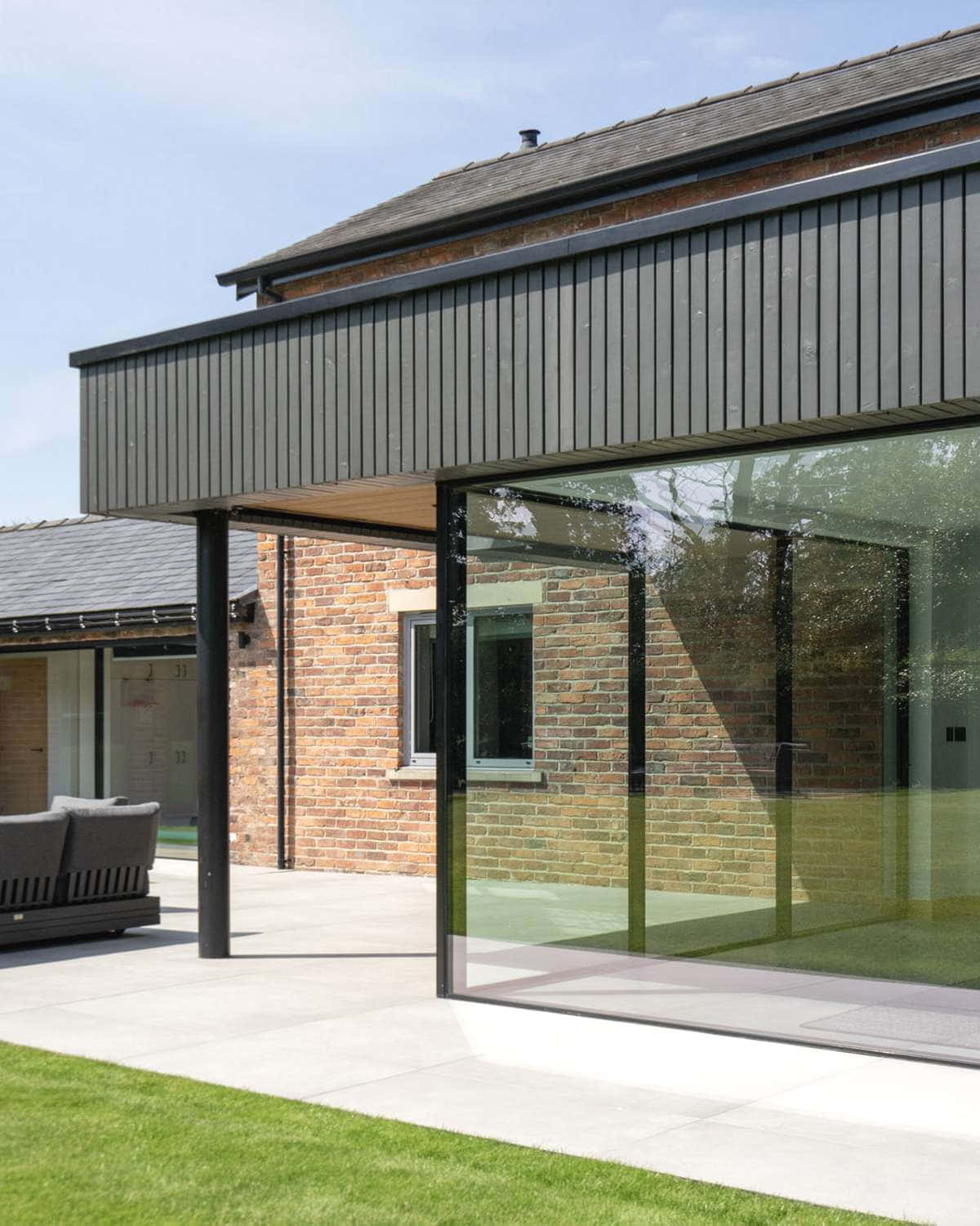 Agate grey composite door against red brickwork