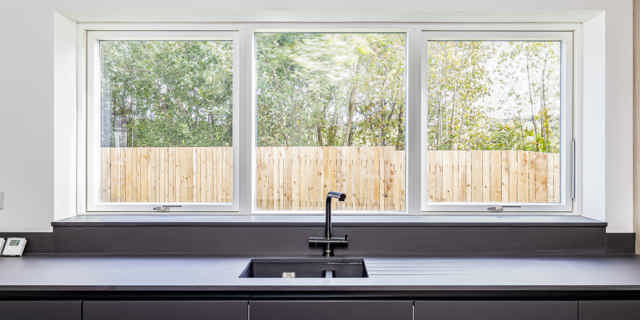 Looking out onto garden through window from kitchen over the sink