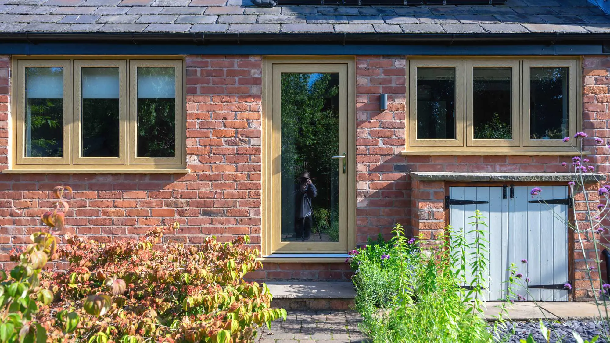 Flush oak effect UPVC windows installed to this barn extension, Cheshire.