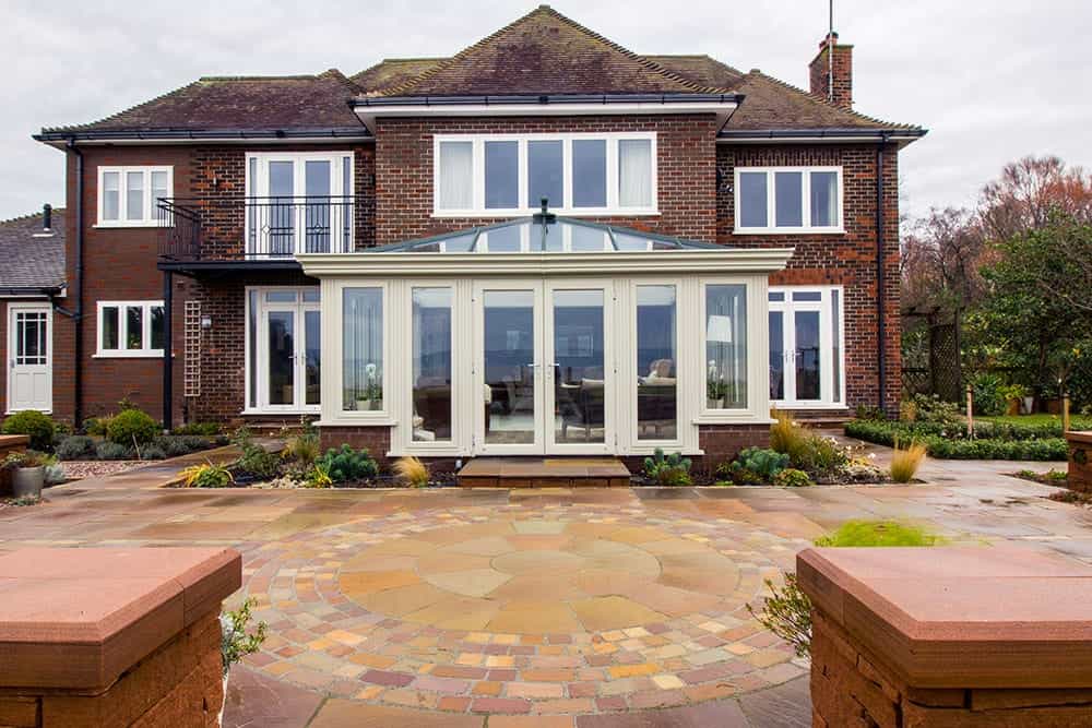 All glass Orangery with timber look windows and doors.