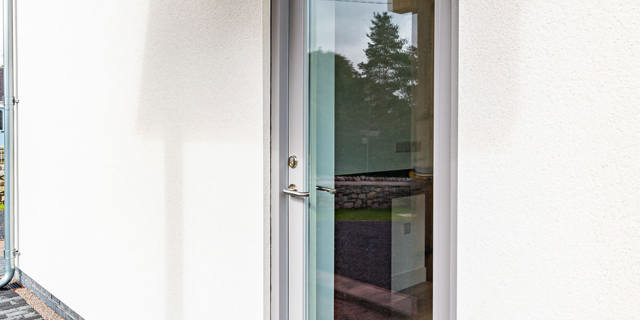 Grey side door to the property 