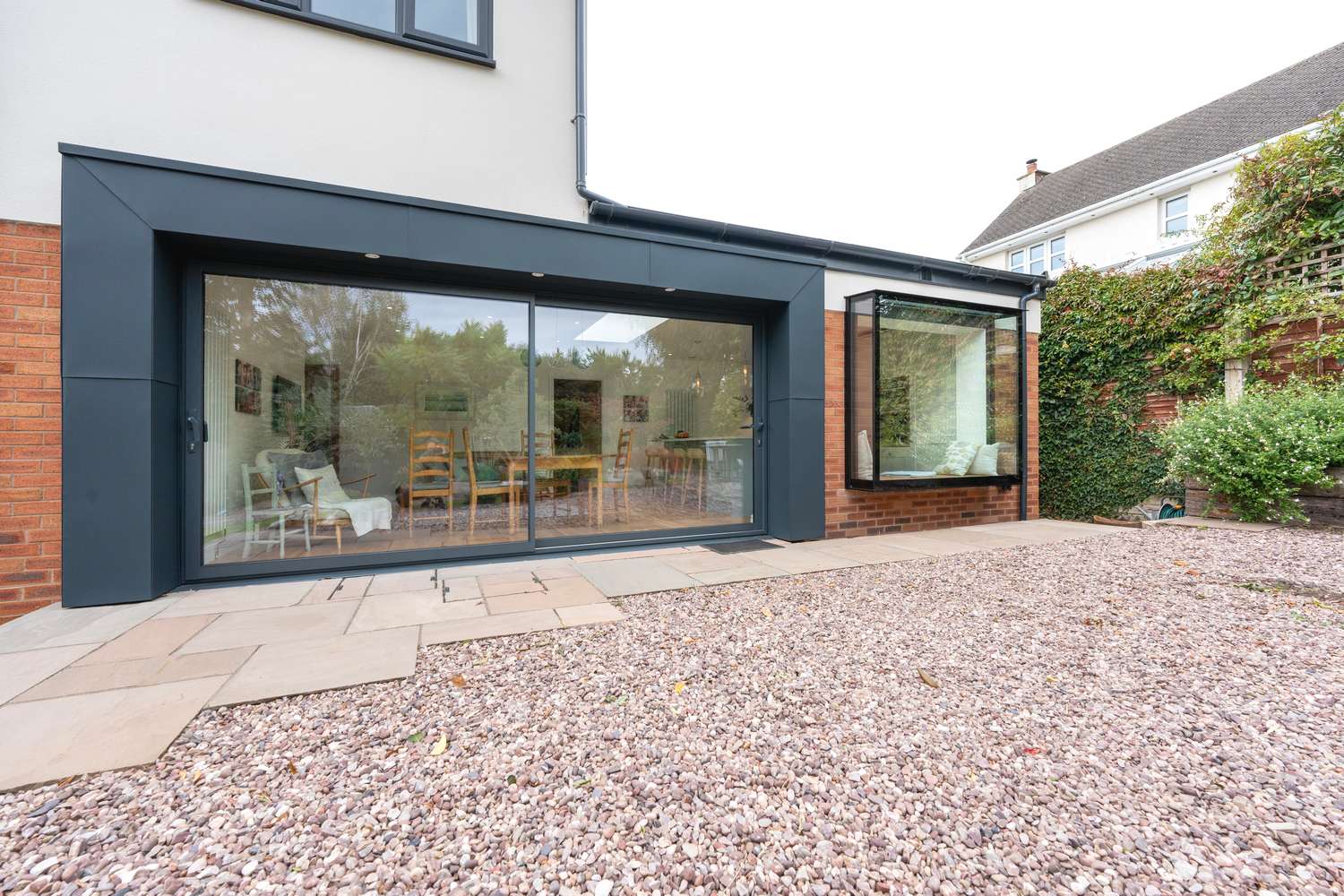 External view of our Knight Slide anthracite grey aluminium sliding doors.