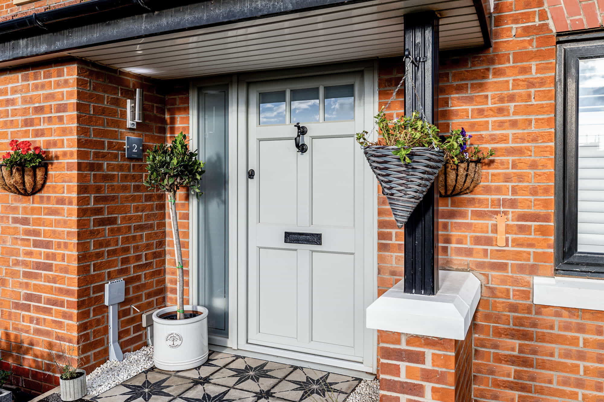 Agate grey composite door against red brickwork