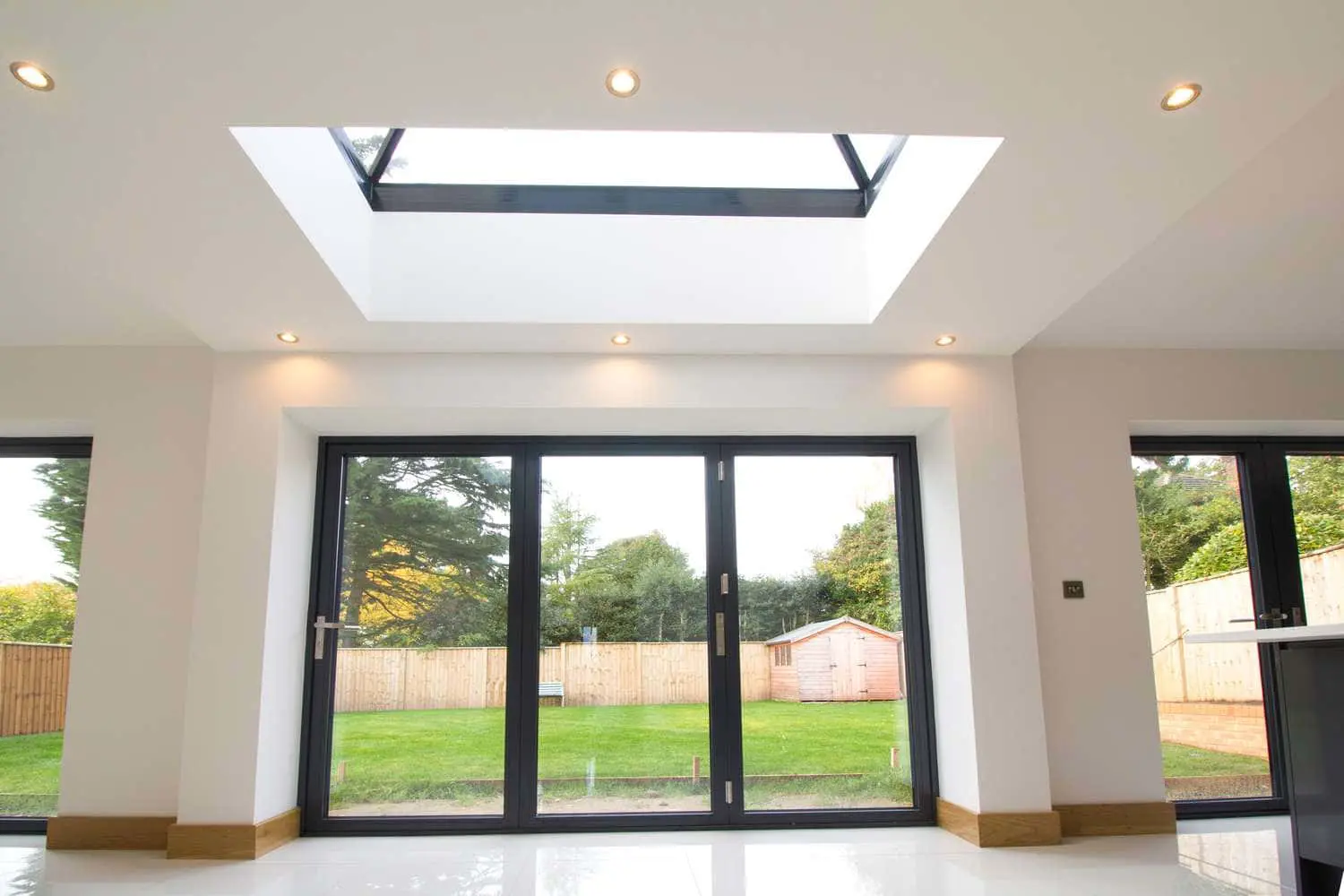 Centor Bi-folds and roof light flooding the open plan kitchen with light.