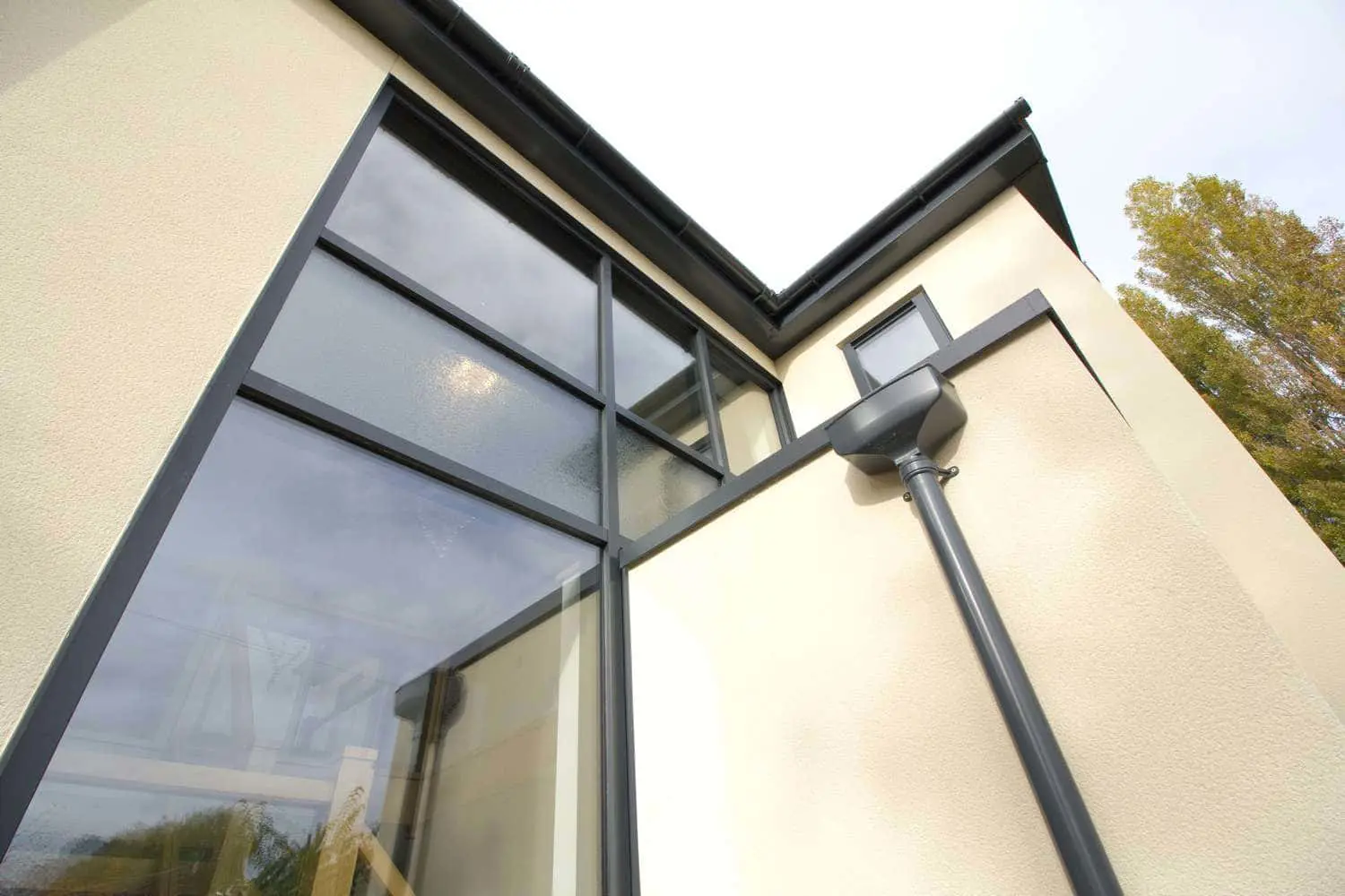 Abstract view of the large curtain wall window creating a grand entrance.