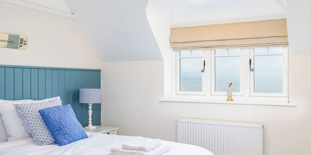 Bedroom in holiday home with duck ornament of window ledge