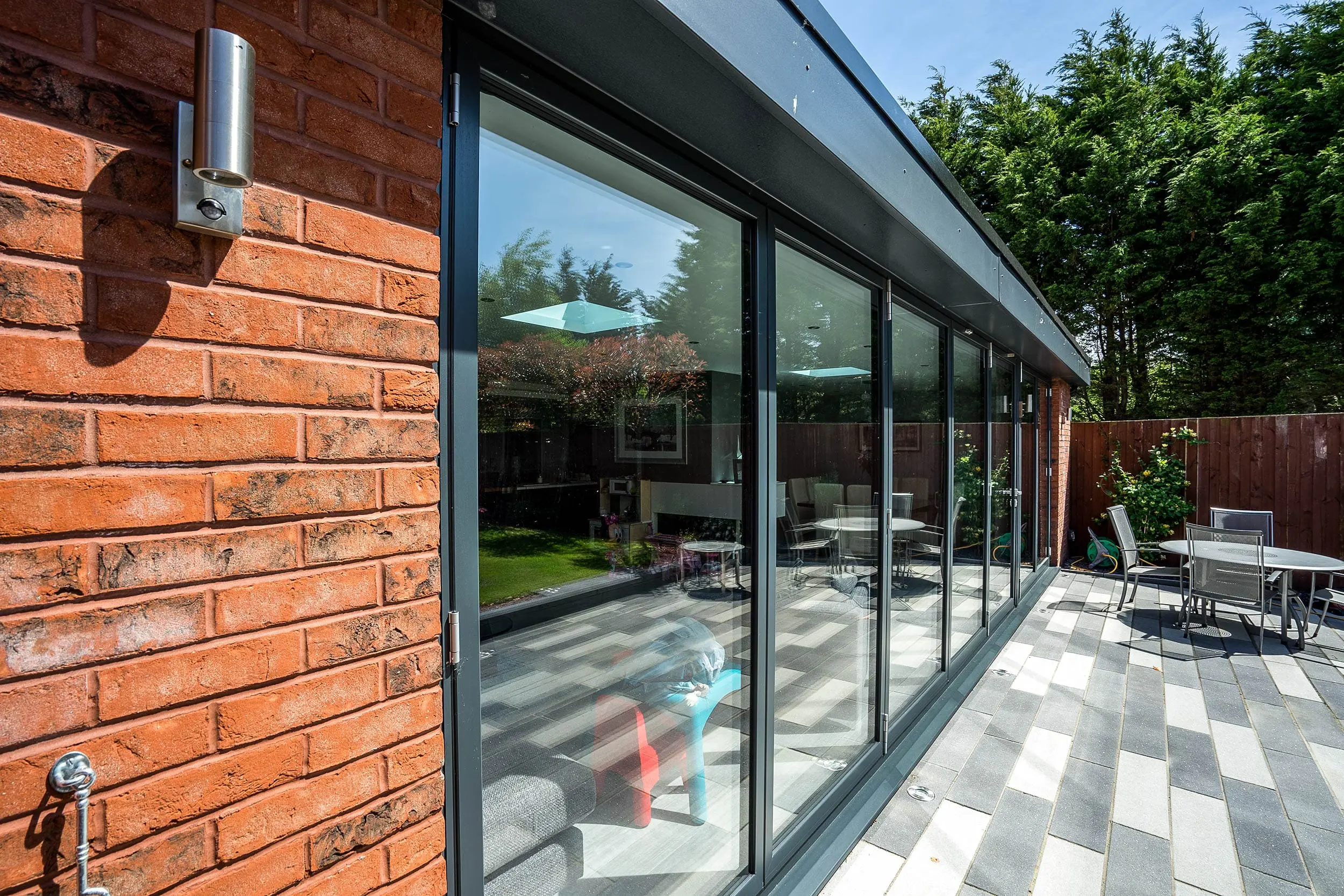 External close up of Aluminium bifold doors allowing lots of Natural light to flood into this property on the Wirral.