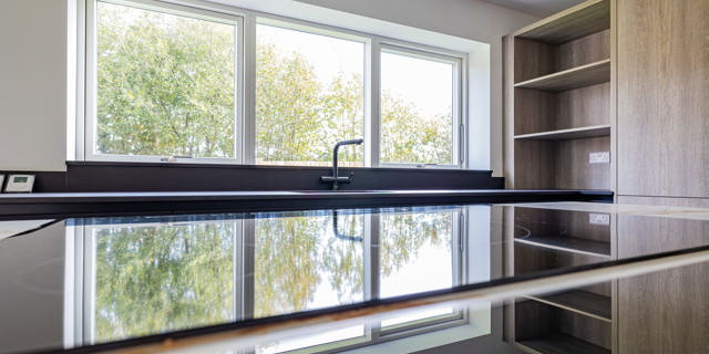 Reflection from the induction hob of kitchen window 