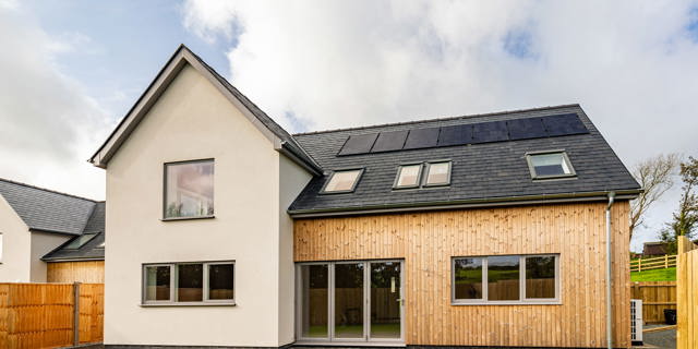 The rear of the property with render and cladding