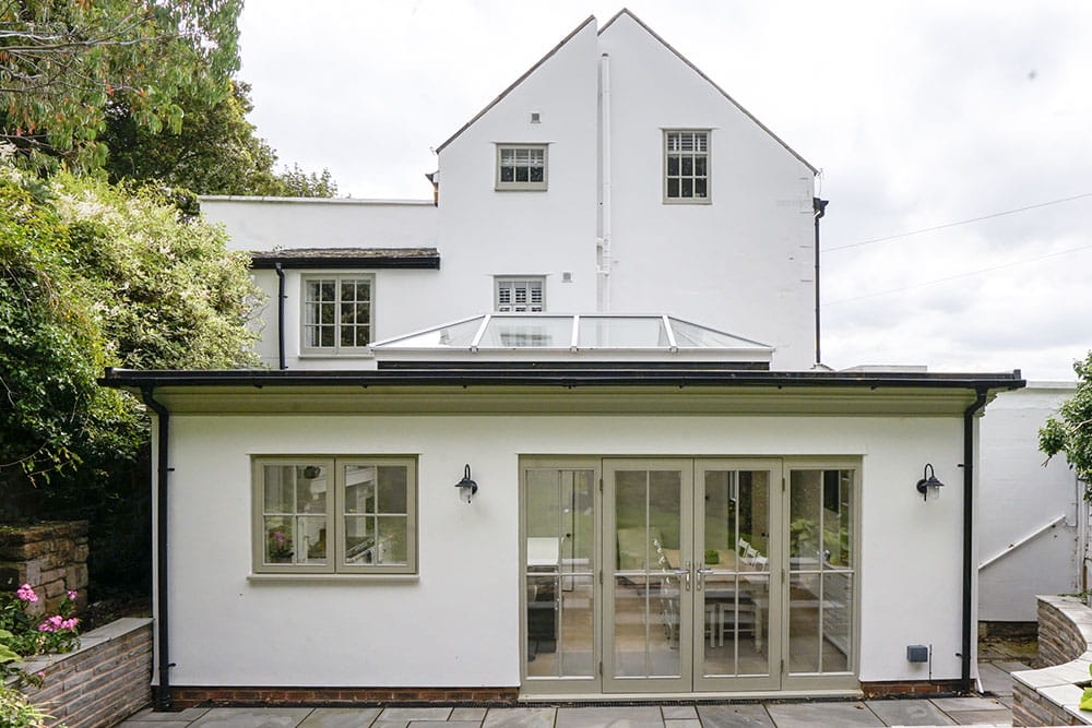 Traditional Orangery with timber windows and aluminium roof lantern.