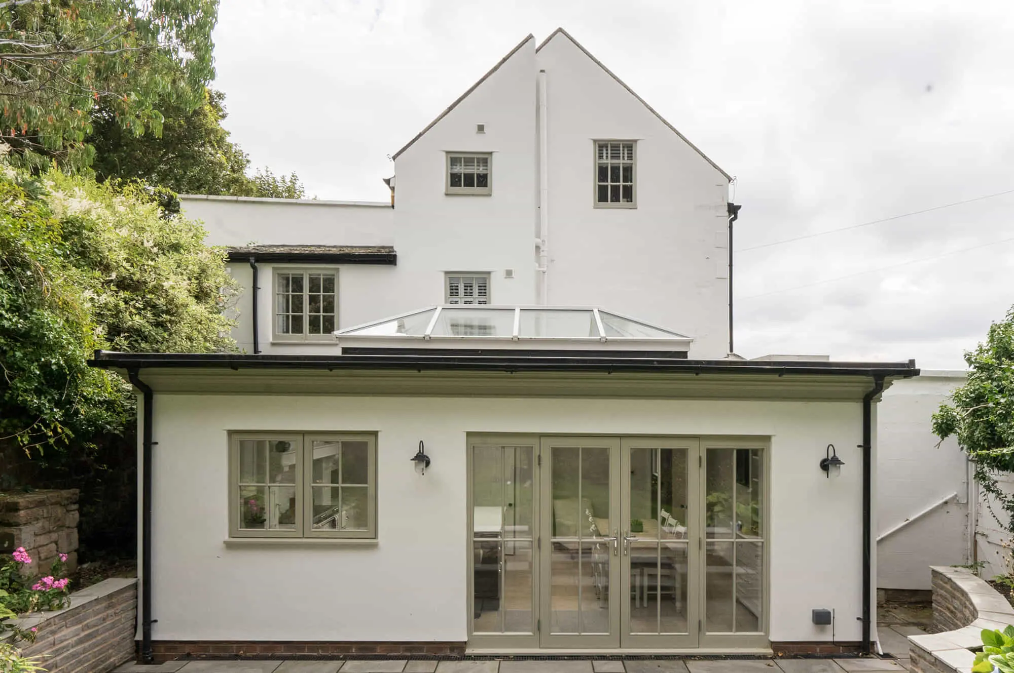 Flat roof extension with timber doors and roof lantern