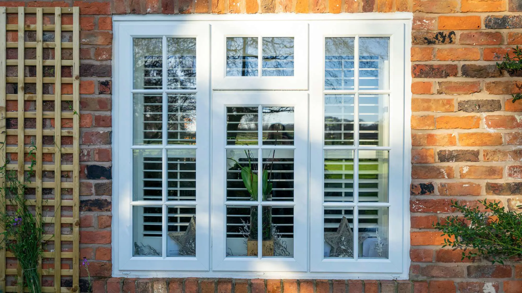 Evolution storm window in white with astragal bars