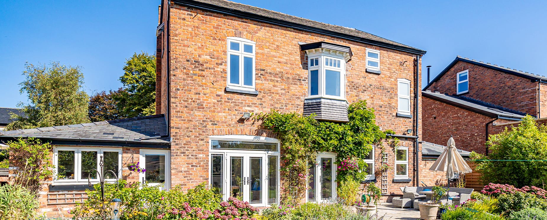 Rear elevation of detached property with bay window 