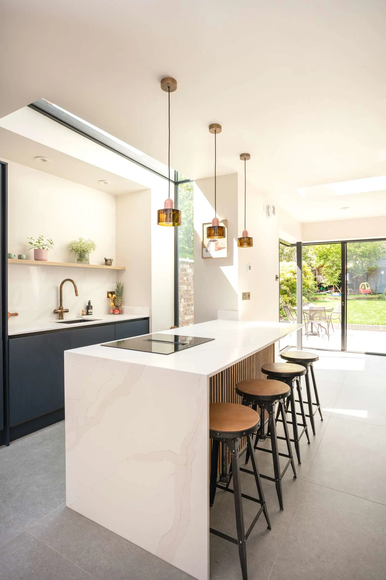 Single storey extension with structural glazing.