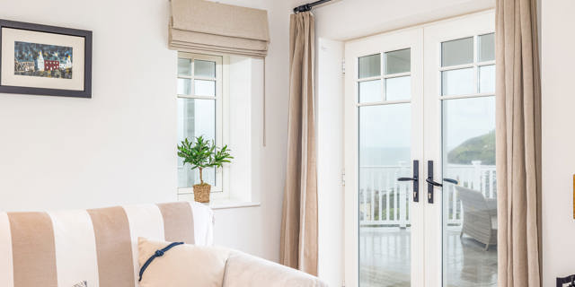 French doors behind sofa in holday home