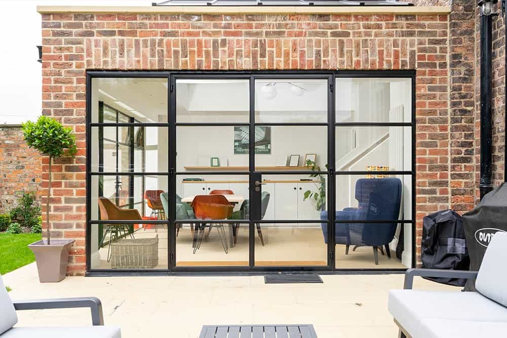 Traditional Orangery with Crittall screens and traditional brickwork.