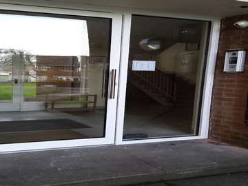 Arrowepark Wirral. Shopline Polyester powder coated Entrance doors . Double glazed . Key pad opening