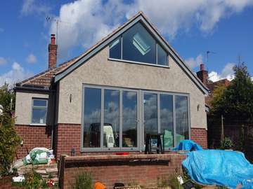 Installtion of Centor Triple glazed Bi fold doors in Heswall Wirral. The doors were triple glazed . The Shaped Aluminium Atrium style windows was fabricared to match the Bi fold doors