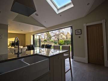 Internal view of modernised open plan living space with Centor bifold doors.