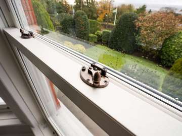 Close up of traditional bronze hardware fitted to our bygone Sash Windows.