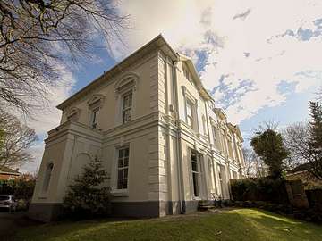 Corner shot of Regency property in Wirral featuring large installation of Roseview sash windows.