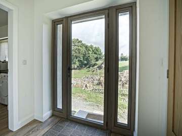 Internal shot of glazed door with dual sidelights.