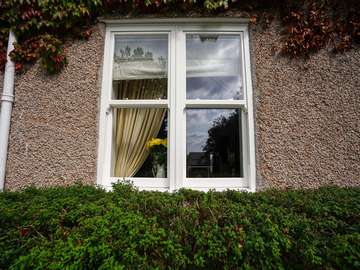 External view of dual sliding sash window installation in Heswall, Wirral.