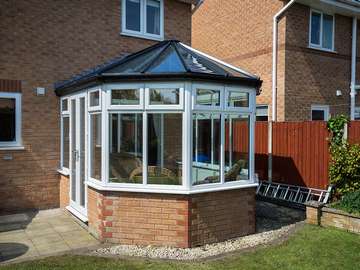 Alternative view of this replacement conservatory. The original base was in good order so was kept however the aluminium conservatory had seen better days and therefore was replaced with a brand new UPVC structure.